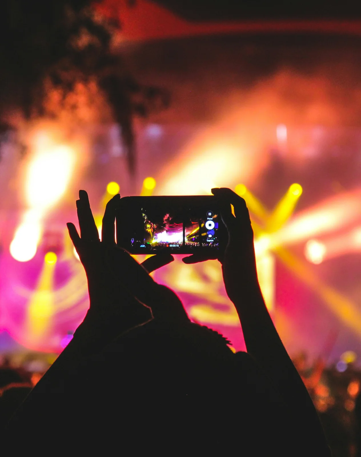 Phone filming a concert during a live event threat monitoring engagement